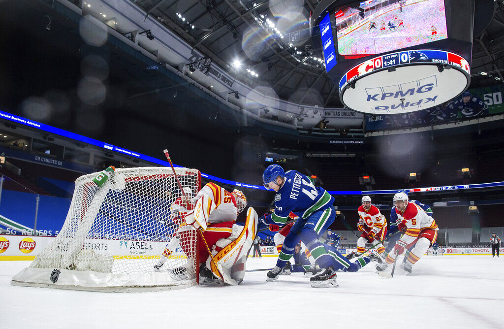 APTOPIX Flames Canucks Hockey